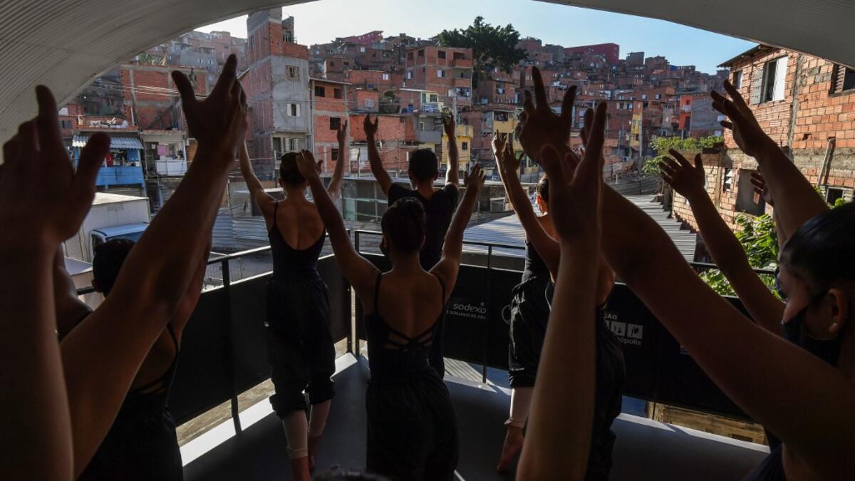 Ballet Paraisopolis students rehearse in Paraisopolis favela, outskirts of Sao Paulo, Brazil on August 27, 2020, amid the new coronavirus COVID-19 pandemic. The 200 ballet students of Paraisopolis, the second largest favela in Sao Paulo, restarted rehearsals after five months with a coreography about a police operation that put their community in mourning last year. NELSON ALMEIDA / AFP