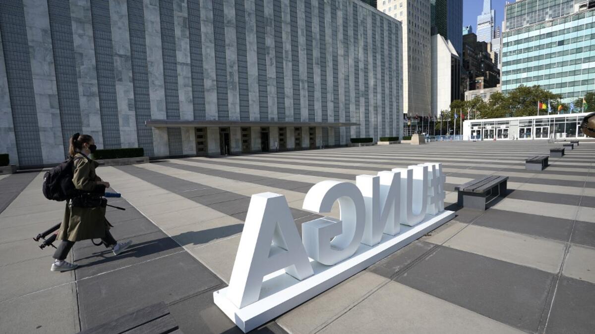 A journalist walks around empty grounds at the United Nations September 22, 2020 during the the 75th General Assembly of the United Nations which is mostly virtual due to the covid-19 pandemic in New York. UN Secretary-General Antonio Guterres urged the world to prevent a Cold War between the United States and China and halt conflicts so it can focus on the covid-19 pandemic. TIMOTHY A. CLARY / AFP