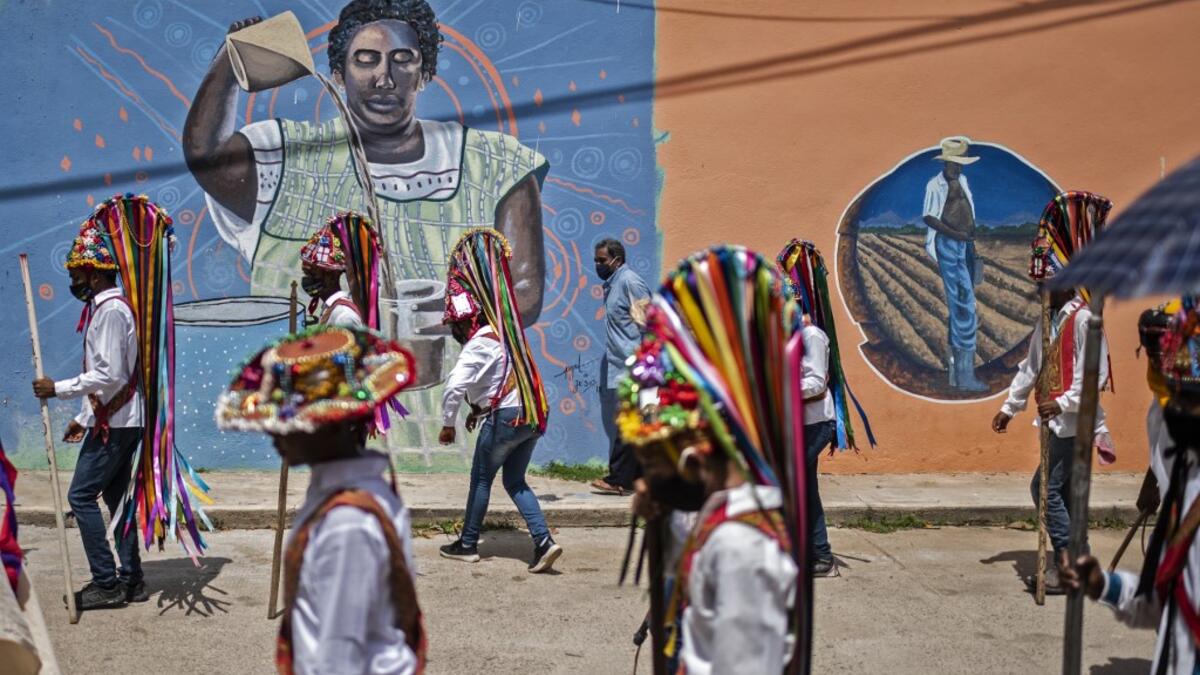 Members of the Afro-Mexican community take part in the annual festival dedicated to San Nicolas Tolentino, in Cuajinicuilapa, Guerrero state, Mexico, on September 10, 2020, amid the COVID-19 coronavirus pandemic. Although there are 1,5 million African descendants in a country of 128 million inhabitants, it is normal to hear that "in Mexico there are no blacks". PEDRO PARDO / AFP