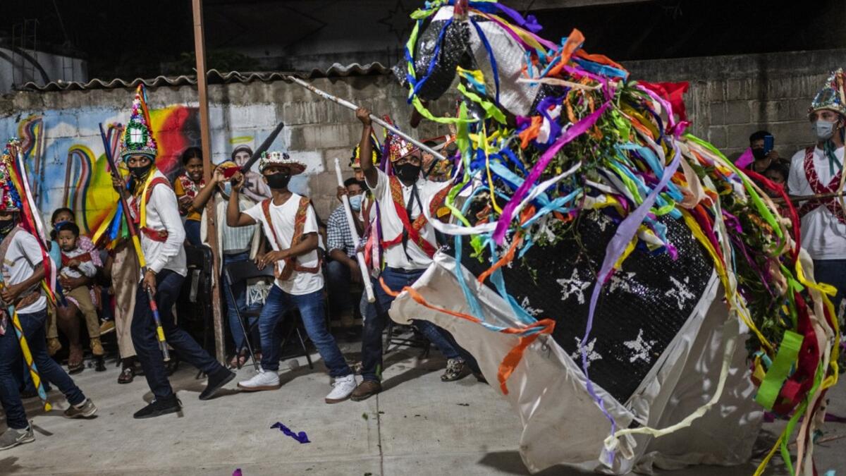 Members of the Afro-Mexican community perform the Toro de Petate dance in the annual festival dedicated to San Nicolas Tolentino, in Cuajinicuilapa, Guerrero state, Mexico, on September 9, 2020, amid the COVID-19 coronavirus pandemic. Although there are 1,5 million African descendants in a country of 128 million inhabitants, it is normal to hear that "in Mexico there are no blacks". PEDRO PARDO / AFP