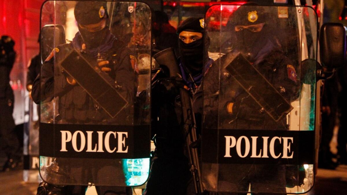 Riot police prepare to disperse pro-democracy protesters in Bangkok on October 15, 2020, after the government declared a state of emergency following an anti-government rally the previous day. STR / AFP