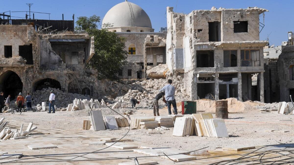 Syrian workers take part in the reconstruction of the Hatab Square in the Jdaideh neighbourhood in Aleppo's Old City on October 17, 2020. AFP