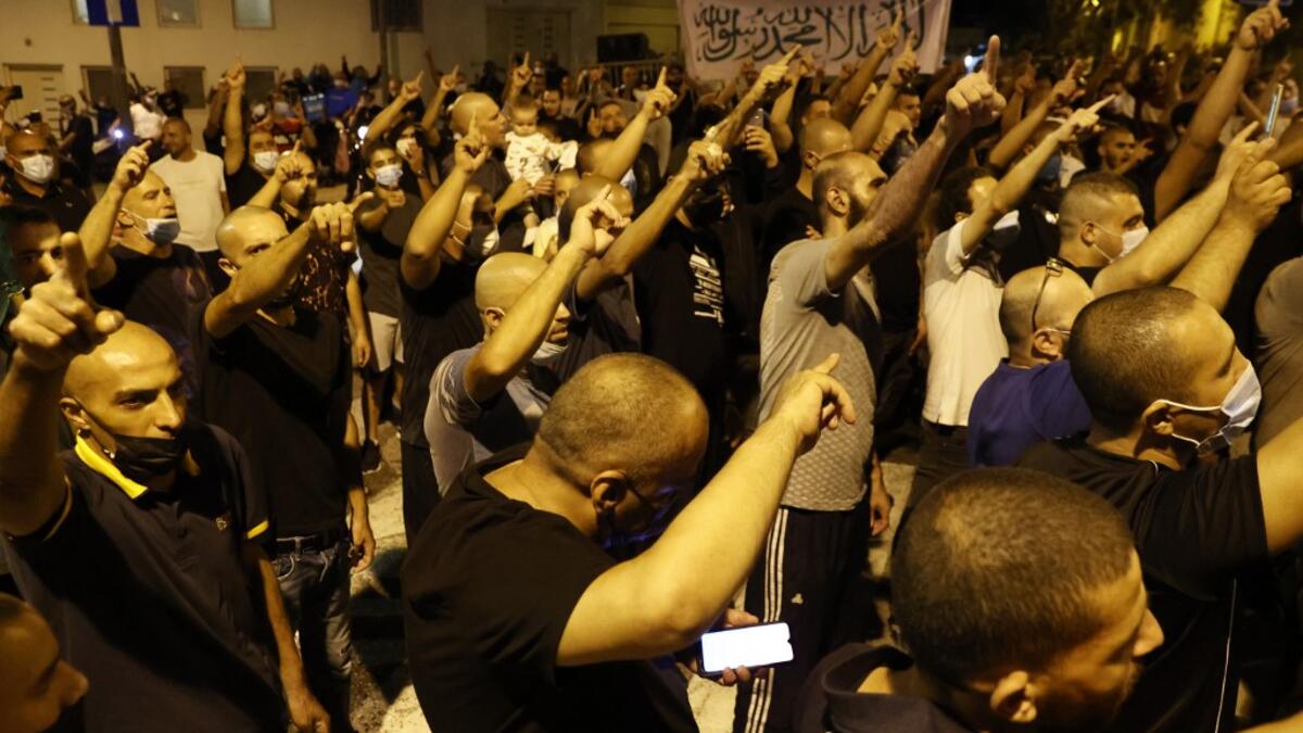 Arab-Israeli protesters gather outside the residence of the French Ambassador to Israel, in Tel Aviv on October 24, 2020, in response to comments by French President Emmanuel Macron defending cartoons of the Prophet Mohammed. JACK GUEZ / AFP