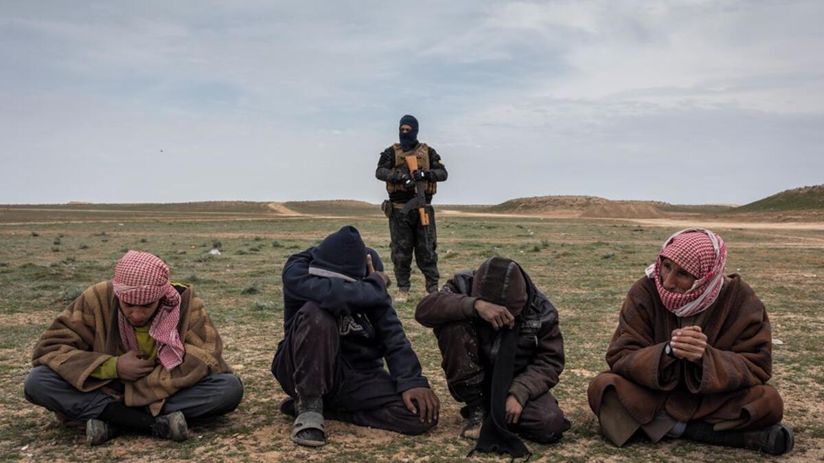 Men who have fled a final area of IS control wait to be questioned near Baghuz, Syria, about their links to the group, on 7 February 2019.⁣ ⁣ From ‘ISIS and its Aftermath in Syria’ by Ivor Prickett (@ivorprickett) for The New York Times (@nytimes).⁣