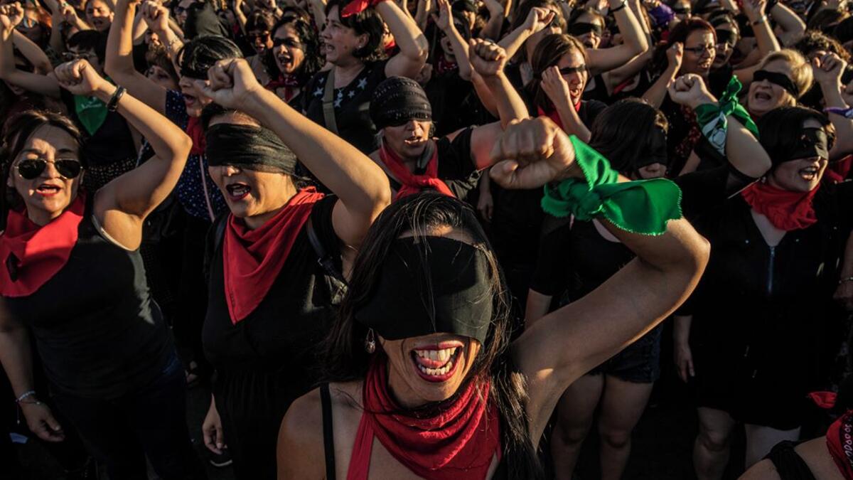 Women in Santiago, Chile, perform ‘Un Violador en tu Camino’ (A Rapist in your Path), a protest song that went viral and came to be used across South America, on 4 December 2019. Many wear red scarves & lipstick symbolizing the sexual nature of assaults, & are blindfolded in solidarity with people blinded by police.⁣ ⁣ From ‘Chile: The Rebellion Against Neoliberalism’ by Fabio Bucciarelli (@fabio_bucciarelli) for L’Espresso (@espressosettimanale).⁣
