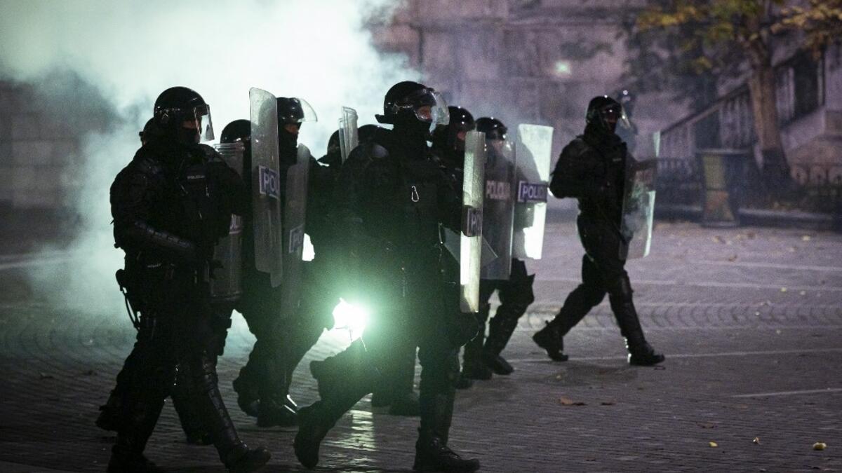 Police officers wearing anti-riot gear charge against protesters during the rally against government’s coronavirus restrictions in Ljubljana on November 5, 2020. Jure Makovec / AFP