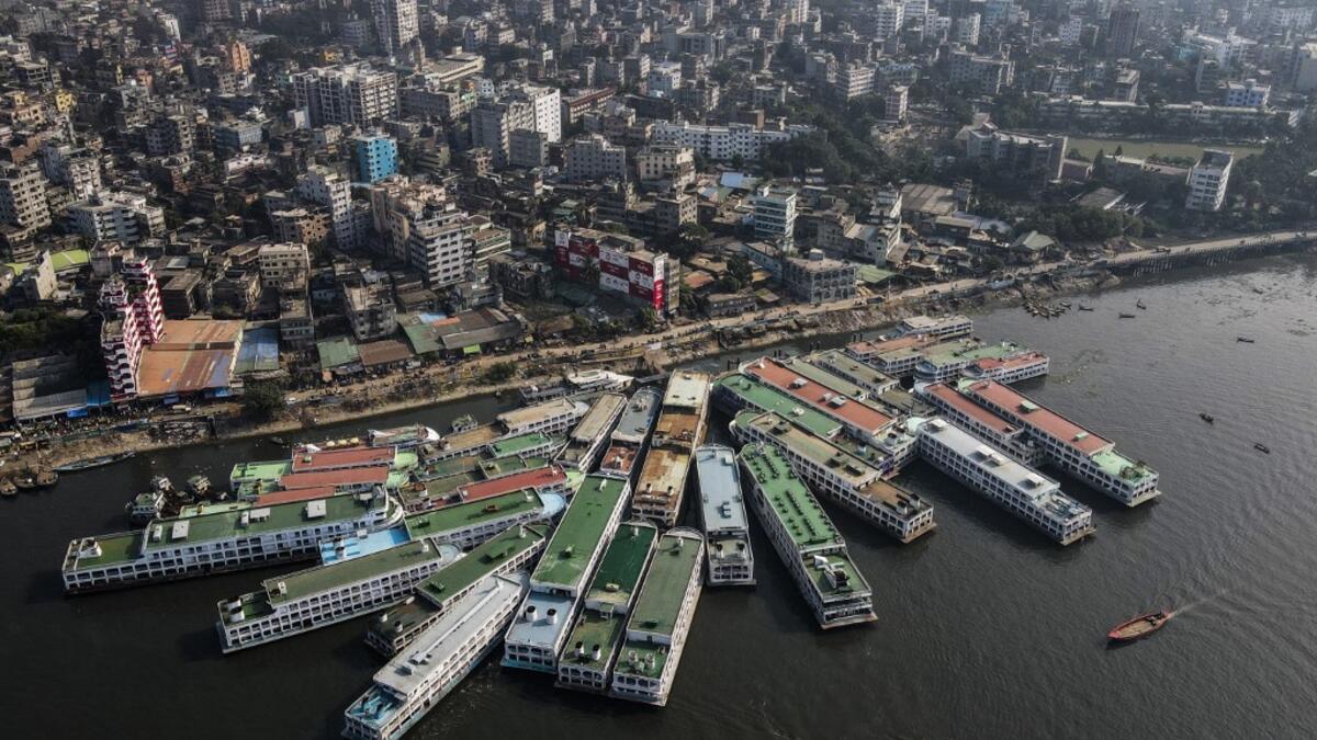 In this aerial photograph taken on November 16, 2020 passenger ferry ships are seen moored on the Buriganga River in Dhaka. Rivers are the lifeblood of the delta nation of 168 million people where much of the low-lying land is accessed via boat, with Bangladesh's strong economic growth of recent years fuelling more investments in new and bigger ships. Munir UZ ZAMAN / AFP
