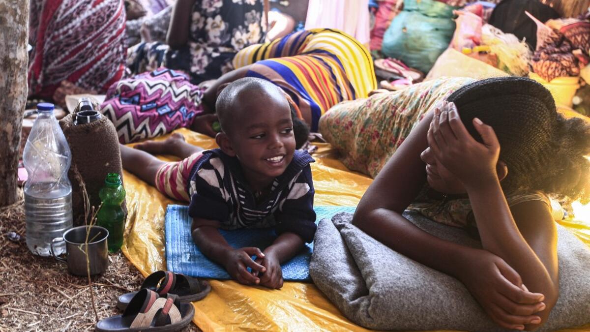 Ethiopian refugee children who fled fighting in Tigray province, lay in a hut at the Um Raquba camp in Sudan's eastern Gedaref province, on November 16, 2020. Sudan -- one of the world's poorest countries, now faced with the massive influx -- has reopened the camp, 80 kilometres (50 miles) from the border. It once housed refugees who fled Ethiopia's 1983-85 famine that killed over a million people. Ebrahim HAMID / AFP