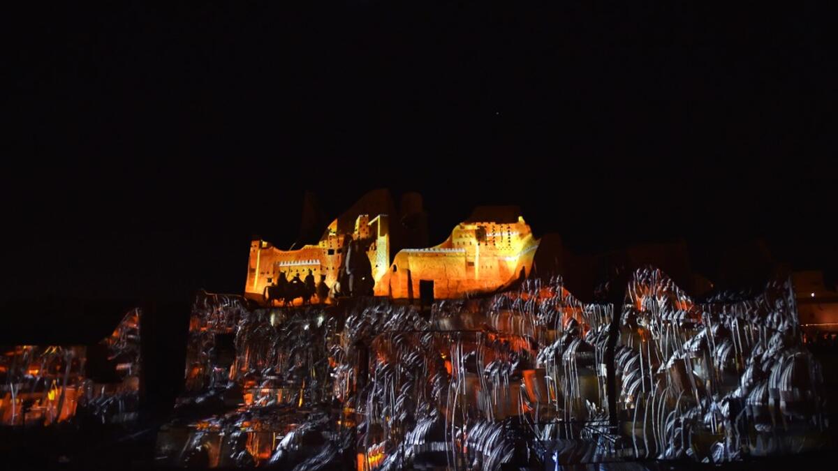 An animation is projected at the historical site of al-Tarif in Diriyah district, on the outskirts of Saudi capital Riyadh, on November 20, 2020. Saudi Arabia hosts the G20 summit on November 21 in a first for an Arab nation, with the downsized virtual forum dominated by efforts to tackle a resurgent coronavirus pandemic and crippling economic crisis. FAYEZ NURELDINE / AFP