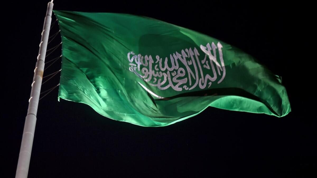 The Saudi national flag flutters at the historical site of al-Tarif in Diriyah district, on the outskirts of Saudi capital Riyadh, on November 20, 2020. Saudi Arabia hosts the G20 summit on November 21 in a first for an Arab nation, with the downsized virtual forum dominated by efforts to tackle a resurgent coronavirus pandemic and crippling economic crisis. FAYEZ NURELDINE / AFP