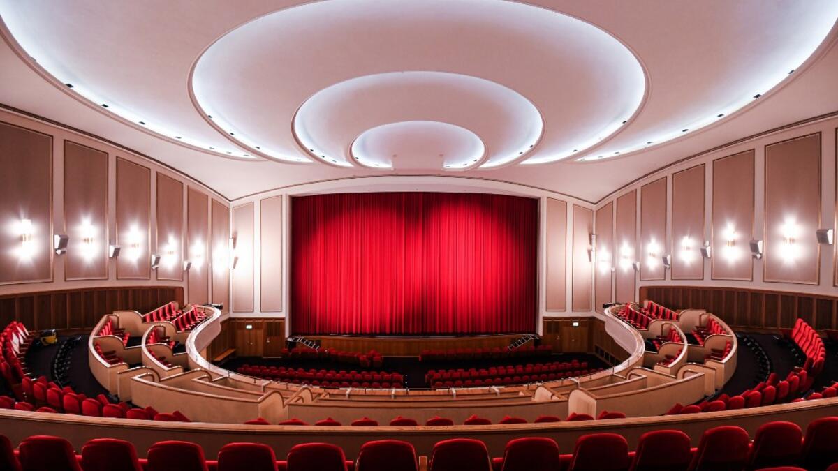 A picture taken on November 19, 2020 shows the closed red curtain at the Lichtburg cinema in Essen, western Germany. The Lichtburg, which was built 1928, is a historical cinema with 1250 seats and is the largest cinema hall in Germany. No public events will take place at theaters until December, 2020 to limit the spread of the novel coronavirus. Ina FASSBENDER / AFP