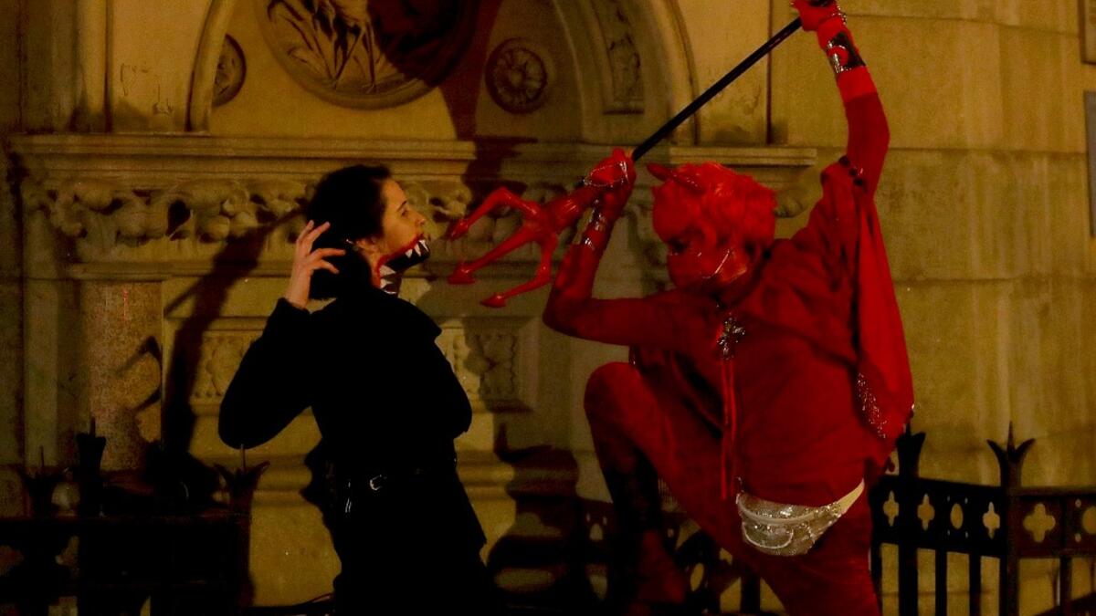 People wear costumes on October 31, 2020 in New York City. Many Halloween events have been canceled or adjusted with additional safety measures due to the ongoing coronavirus. Arturo Holmes/Getty Images/AFP