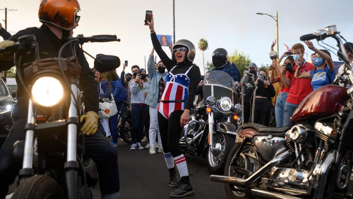 People celebrate the results of the 2020 Presidential election along West Hollywood on November 7, 2020 in Los Angeles, California. Emma McIntyre / GETTY IMAGES NORTH AMERICA / Getty Images via AFP