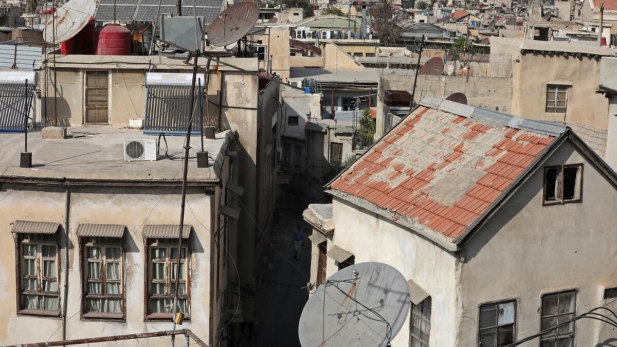 A partial view shows the old part of Syria's capital Damascus on October 28, 2020. The old city of the Syrian capital is famed for its elegant century-old houses, usually two storeys built around a leafy rectangular courtyard with a carved stone fountain at its centre. While the capital has been largely spared the violence of Syria's almost ten-year war, several of these traditional homes have been abandoned by their owners or damaged in the conflict. LOUAI BESHARA / AFP