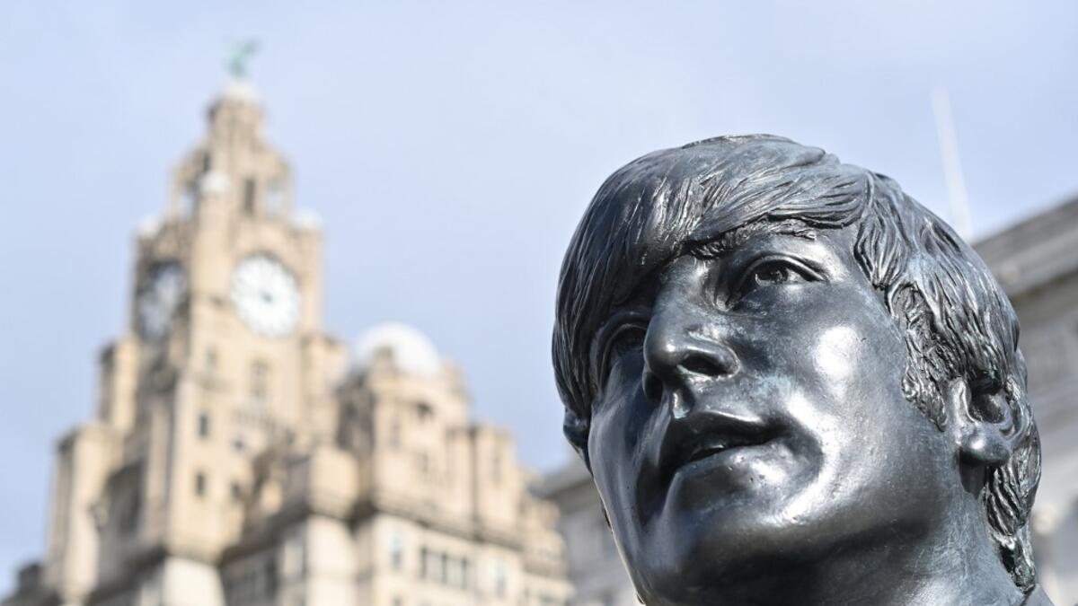 In this file photo taken on October 07, 2020 a statue of John Lennon and members of the Beatles stands in central Liverpool, northwest England on October 7, 2020. John Lennon's career was cut short 40 years ago, on December 8, 1980, when he was shot dead in New York. Paul ELLIS / AFP