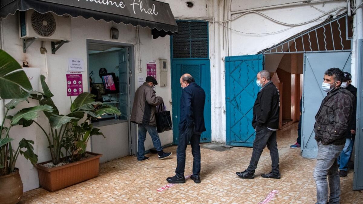 Moroccan Jewish and Muslim men queue in front of the kosher bakery 'Madame Khal' in the western Moroccan port city of Casablanca, on December 11, 2020 After the United Arab Emirates, Bahrain and Sudan, Morocco is the fourth Arab country since August to commit to establishing diplomatic relations with the Israel. In the 1950s and 60s, Jews from Iraq, Yemen and Morocco migrated to the Jewish state, where key posts were in the hands of Ashkenazi Jews, who hail from Europe. FADEL SENNA / AFP