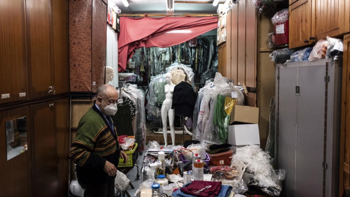 Augusto Grilli works in his " Alfa Theatre" laboratory in Turin, on November 30, 2020. The Grilli family has a collection of more than 20,000 objects from around the world, everything from theatres, marionettes and glove puppets to shadow figures and silhouettes. A long-time dream of Grilli and his wife Mariarosa, 78, the museum is due to open in 2023 in Turin, financed both privately and publicly with the help of different institutions.  Marco Bertorello / AFP