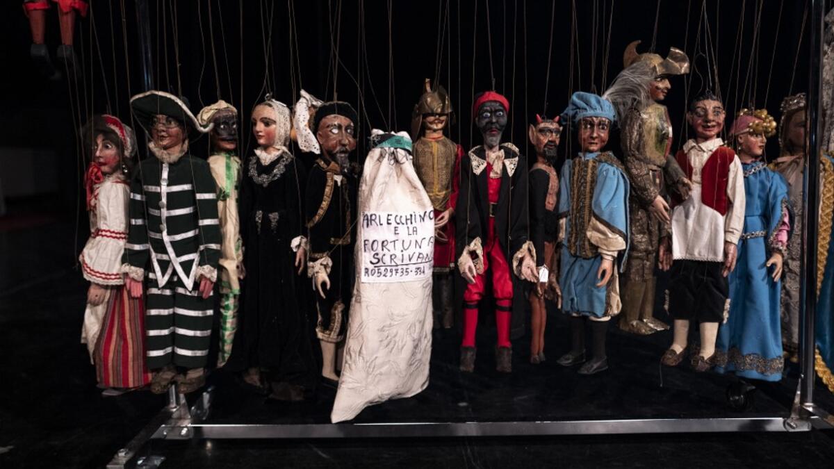 Puppets of Grilli's family collection are pictured on the stage at the " Alfa Theatre" in Turin, on November 30, 2020. The Grilli family has a collection of more than 20,000 objects from around the world, everything from theatres, marionettes and glove puppets to shadow figures and silhouettes. A long-time dream of Grilli and his wife Mariarosa, 78, the museum is due to open in 2023 in Turin, financed both privately and publicly with the help of different institutions.  Marco Bertorello / AFP