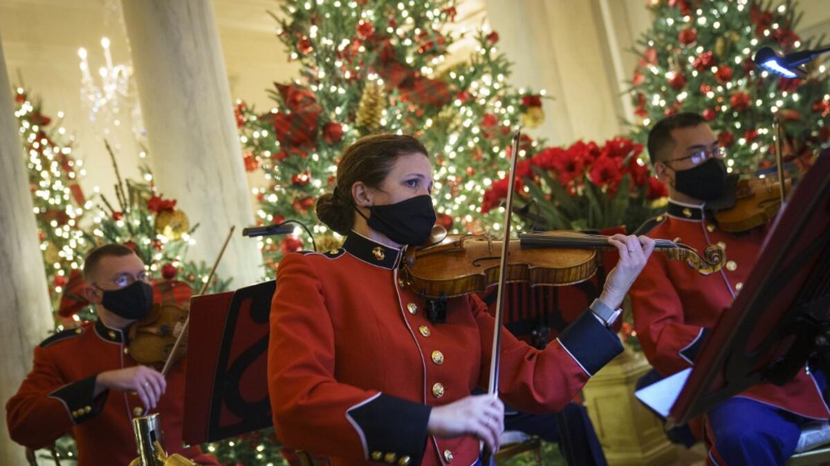 A military band plays Christmas music in the Grand Foyer of the White House on November 30, 2020 in Washington, DC. This year's theme for the White House Christmas decorations is "America the Beautiful." Drew Angerer/Getty Images/AFP