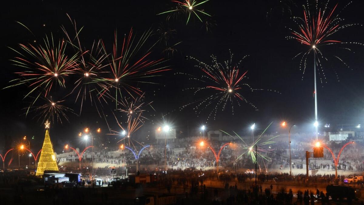 Iraqis celebrate New Year's Eve in the northern city Mosul on December 31, 2020. Zaid AL-OBEIDI / AFP