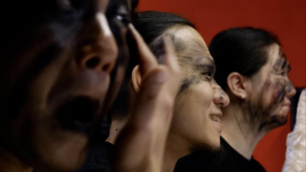 This picture taken on December 3, 2020 shows members of Taiwanese death metal band 'Dharma' putting on makeup during a rehearsal in Taipei. Sam Yeh / AFP