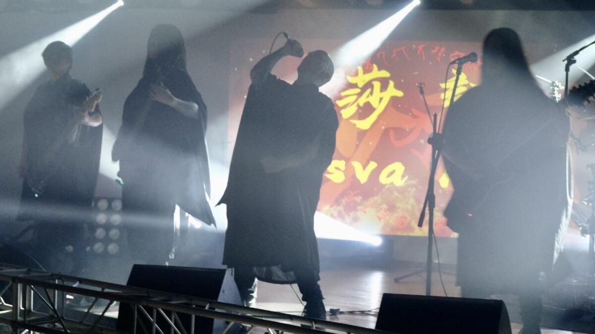 This picture taken on December 3, 2020 shows Joe Henley (C), a leading vocalist of Taiwanese death metal band 'Dharma' singing during a rehearsal in Taipei. Sam Yeh / AFP