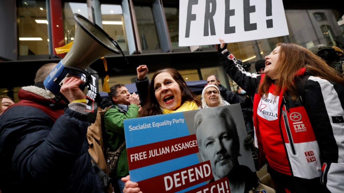 Supporters of Wikileaks founder Julian Assange celebrate outside the Old Bailey court in central London after a judge ruled that Assange should not be extradited to the United States to face espionage charges for publishing secret documents online on January 4, 2021. Tolga Akmen / AFP