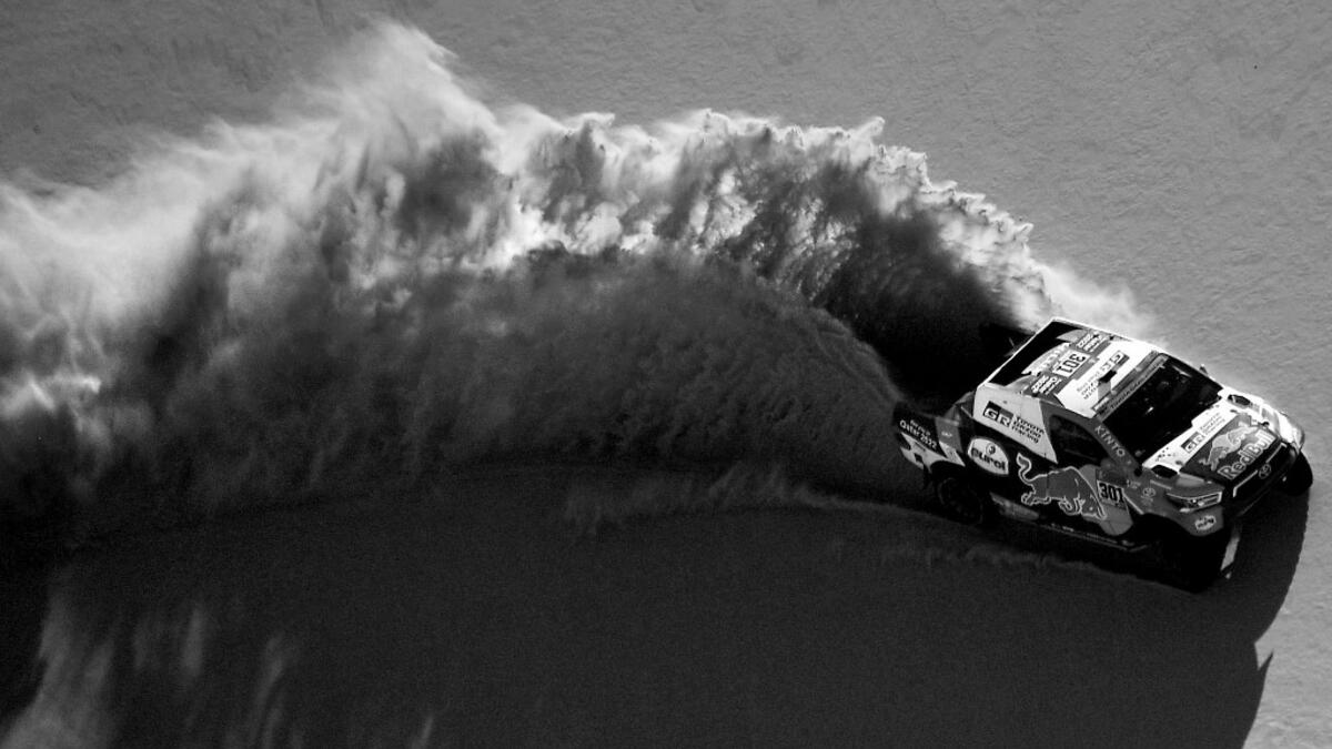 Toyota's driver Nasser Al-Attiyah of Qatar and his co-driver Mathieu Baumel of France compete during Stage 3 of the Dakar Rally 2021 around Wadi Ad-Dawasir, in Saudi Arabia, on January 5, 2021. FRANCK FIFE / AFP