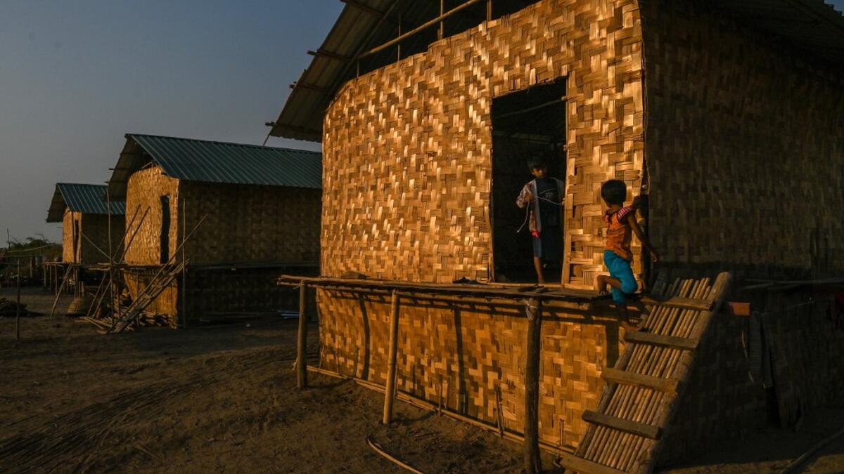 This photo taken on January 11, 2021 shows Chin children playing in Bethel village in Hmawbi, on the outskirts of Yangon, where hundreds of members of the Chin ethnic community have settled after being displaced by fighting between Myanmar's military and the Arakan Army in the country's north.  Ye Aung THU / AFP