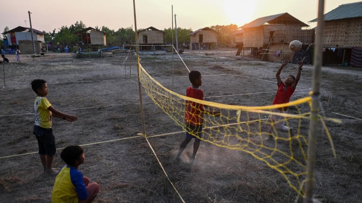 This photo taken on January 11, 2021 shows Chin children playing in Bethel village in Hmawbi, on the outskirts of Yangon, where hundreds of members of the Chin ethnic community have settled after being displaced by fighting between Myanmar's military and the Arakan Army in the country's north.  Ye Aung THU / AFP