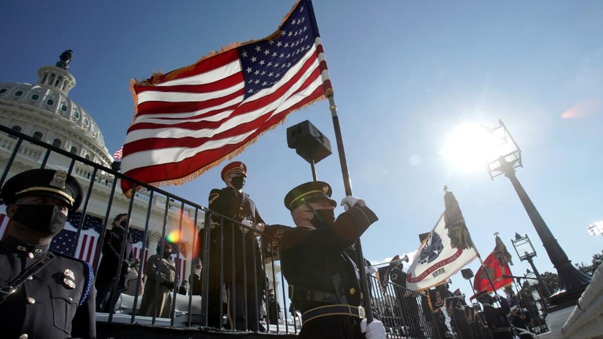 The military honor guard arrives during the 59th Presidential Inauguration on January 20, 2021 in Washington, DC. During today’s inauguration ceremony Joe Biden becomes the 46th president of the United States. Greg Nash - Pool/Getty Images/AFP