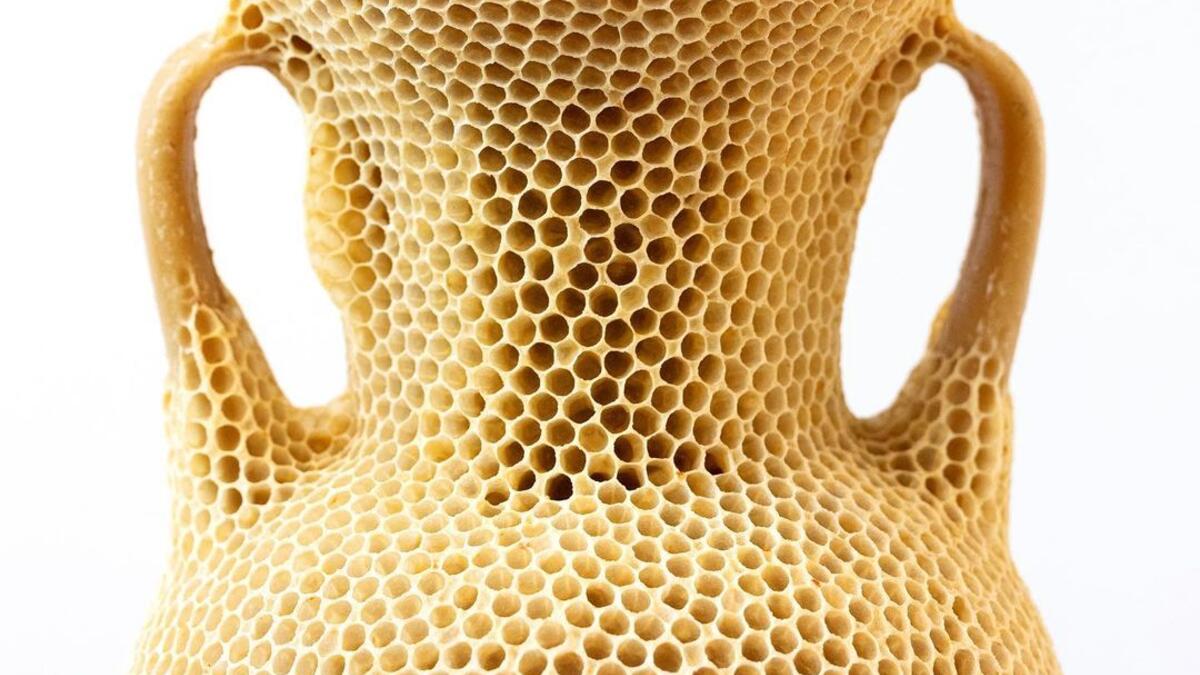 The Honeycomb Amphora I / 2020 “made by bees” series Materials: natural beeswax, museum glass, wood, re-used beehives (Instagram)