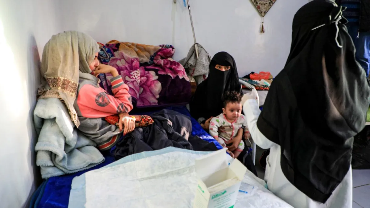 Al-Anoud Hussain Sheryan (L), a 19-year-old girl disfigured in an acid attack by her abusive husband, sits at a hospital where she is undergoing treatment in Yemen's capital Sanaa on January 28, 2021. Married at the age of 12, rejected at 16, and then disfigured in an acid attack, Sheryan's fate is a shocking illustration of abuse in a society beset by war and poverty. Now aged 19, the young Yemeni woman agreed to relate her ordeal at the hands of her abusive husband -- rare testimony in a country where dom