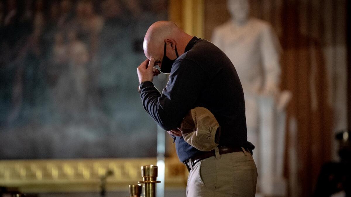 Capitol Police Officers pay their respects to late US Capitol Police officer Brian Sicknick as he lies in honor in the US Capitol Rotunda in Washington, DC February 2, 2021. Erin Schaff / POOL / AFP