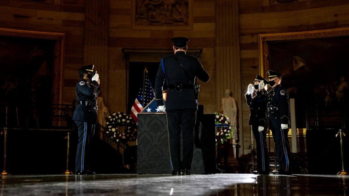 Capitol Police Officers pay their respects to late US Capitol Police officer Brian Sicknick as he lies in honor in the US Capitol Rotunda in Washington, DC February 2, 2021. Erin Schaff / POOL / AFP