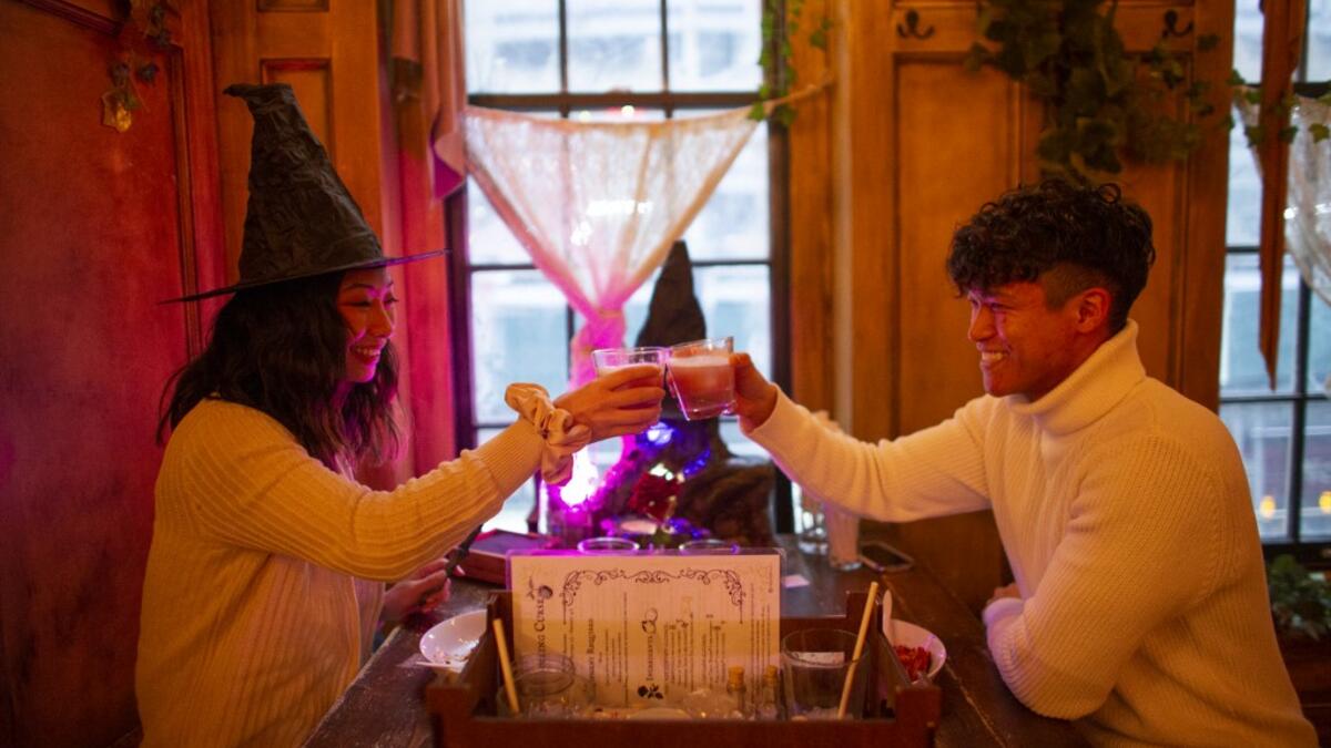 People celebrate Valentine's day at Magical pub The Cauldron in New York on February 13, 2021. New York Restaurants reopened on Friday Indoor dining at 25% capacity for Valentine's weekend. Kena Betancur / AFP