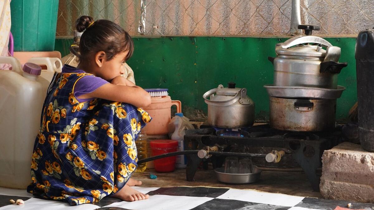 A Yemeni girl sits at the Jaw al-Naseem camp for internally displaced people on the outskirts of the northern city of Marib, on February 18, 2021 in the Saudi-backed Yemeni government's last northern bastion. Until early last year, life in Marib city was relatively peaceful despite the Yemen's civil war that erupted in 2014. The United Nations warned last week of a potential humanitarian disaster if the fight for Marib continues, saying it has put "millions of civilians at risk". More than 3.3 million have