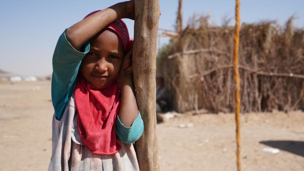 A Yemeni girl stands at the Jaw al-Naseem camp for internally displaced people on the outskirts of the northern city of Marib, on February 18, 2021 in the Saudi-backed Yemeni government's last northern bastion. Until early last year, life in Marib city was relatively peaceful despite the Yemen's civil war that erupted in 2014. The United Nations warned last week of a potential humanitarian disaster if the fight for Marib continues, saying it has put "millions of civilians at risk". More than 3.3 million hav