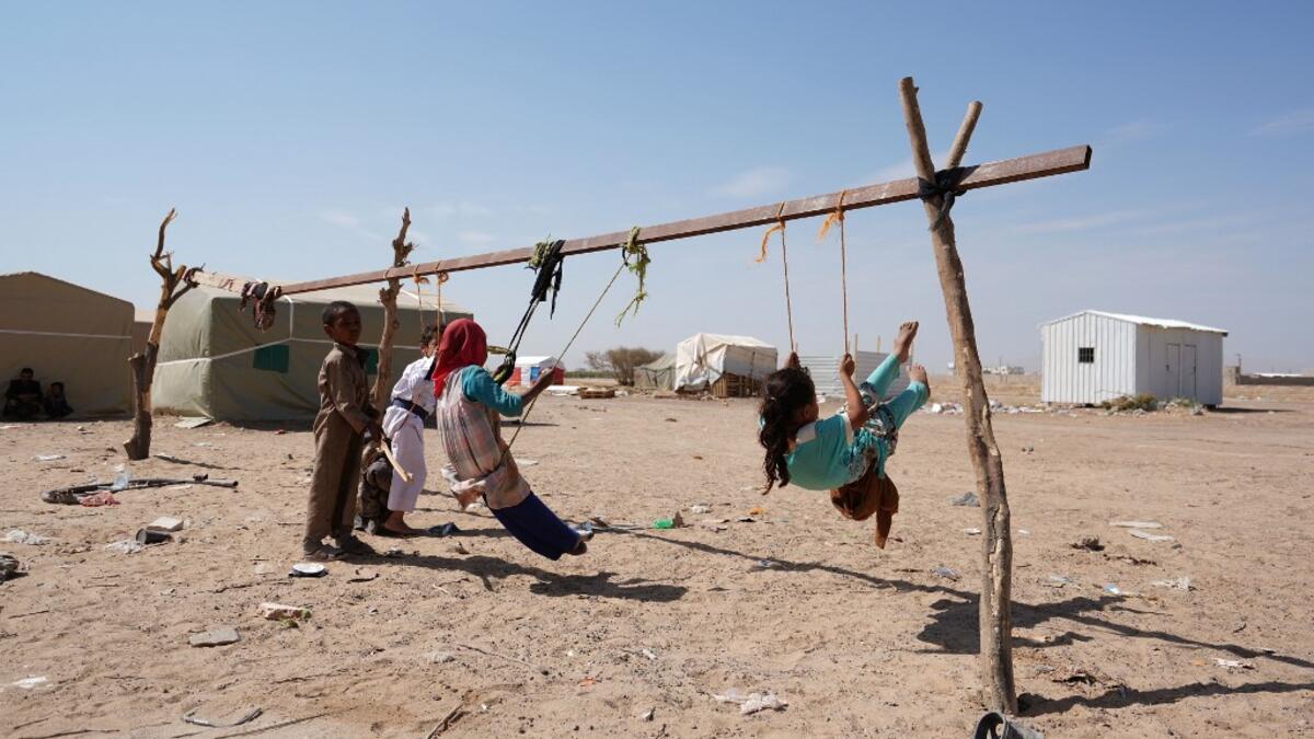 Yemeni children play at the Jaw al-Naseem camp for internally displaced people on the outskirts of the northern city of Marib, on February 18, 2021 in the Saudi-backed Yemeni government's last northern bastion. Until early last year, life in Marib city was relatively peaceful despite the Yemen's civil war that erupted in 2014. The United Nations warned last week of a potential humanitarian disaster if the fight for Marib continues, saying it has put "millions of civilians at risk". More than 3.3 million hav