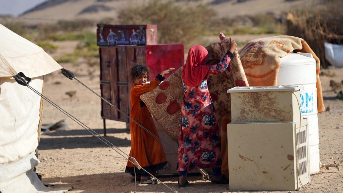 Yemeni children are pictured at the Jaw al-Naseem camp for internally displaced people on the outskirts of the northern city of Marib, on February 18, 2021 in the Saudi-backed Yemeni government's last northern bastion. Until early last year, life in Marib city was relatively peaceful despite the Yemen's civil war that erupted in 2014. The United Nations warned last week of a potential humanitarian disaster if the fight for Marib continues, saying it has put "millions of civilians at risk". More than 3.3 mil