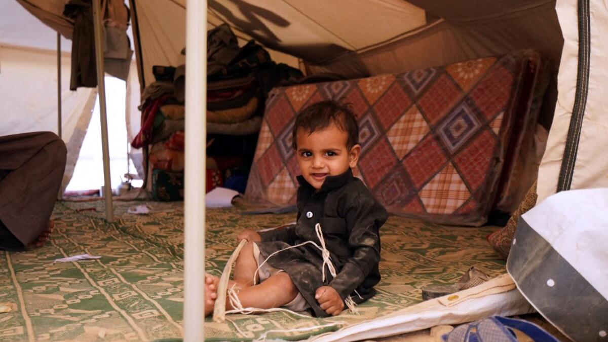 A Yemeni child sits in a tent at a camp for internally displaced people on the outskirts of the northern city of Marib, on February 18, 2021 in the Saudi-backed Yemeni government's last northern bastion. Until early last year, life in Marib city was relatively peaceful despite the Yemen's civil war that erupted in 2014. The United Nations warned last week of a potential humanitarian disaster if the fight for Marib continues, saying it has put "millions of civilians at risk". More than 3.3 million have been