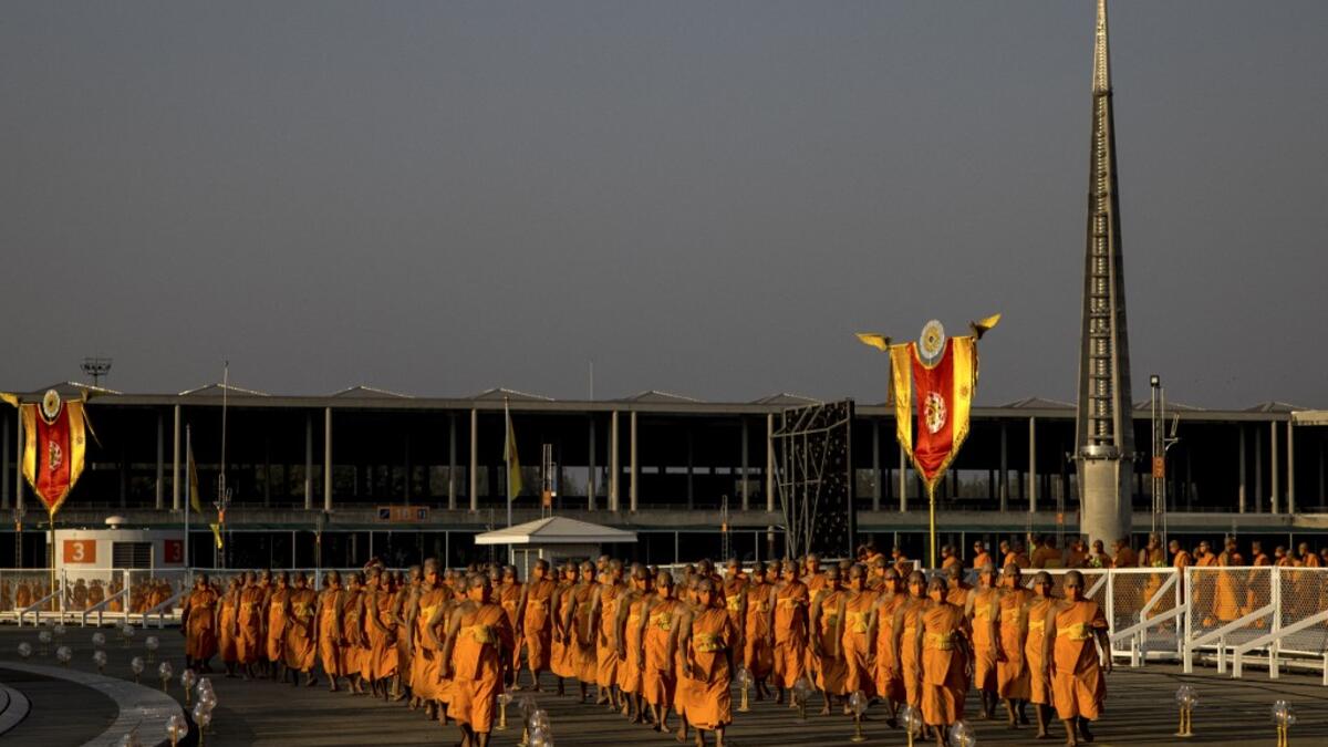 Buddhist monks arrive for Makha Bucha celebrations at Wat Dhammakaya, north of Bangkok on February 26, 2021. Jack TAYLOR / AFP