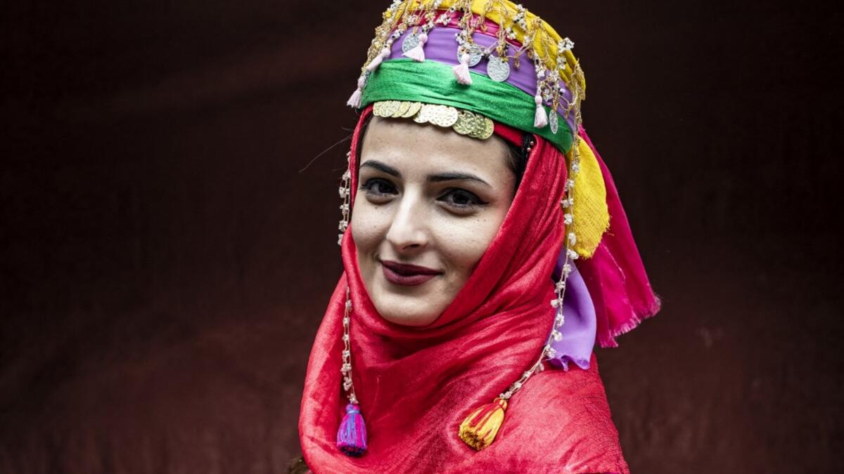 A Syrian Kurdish woman in traditional attire