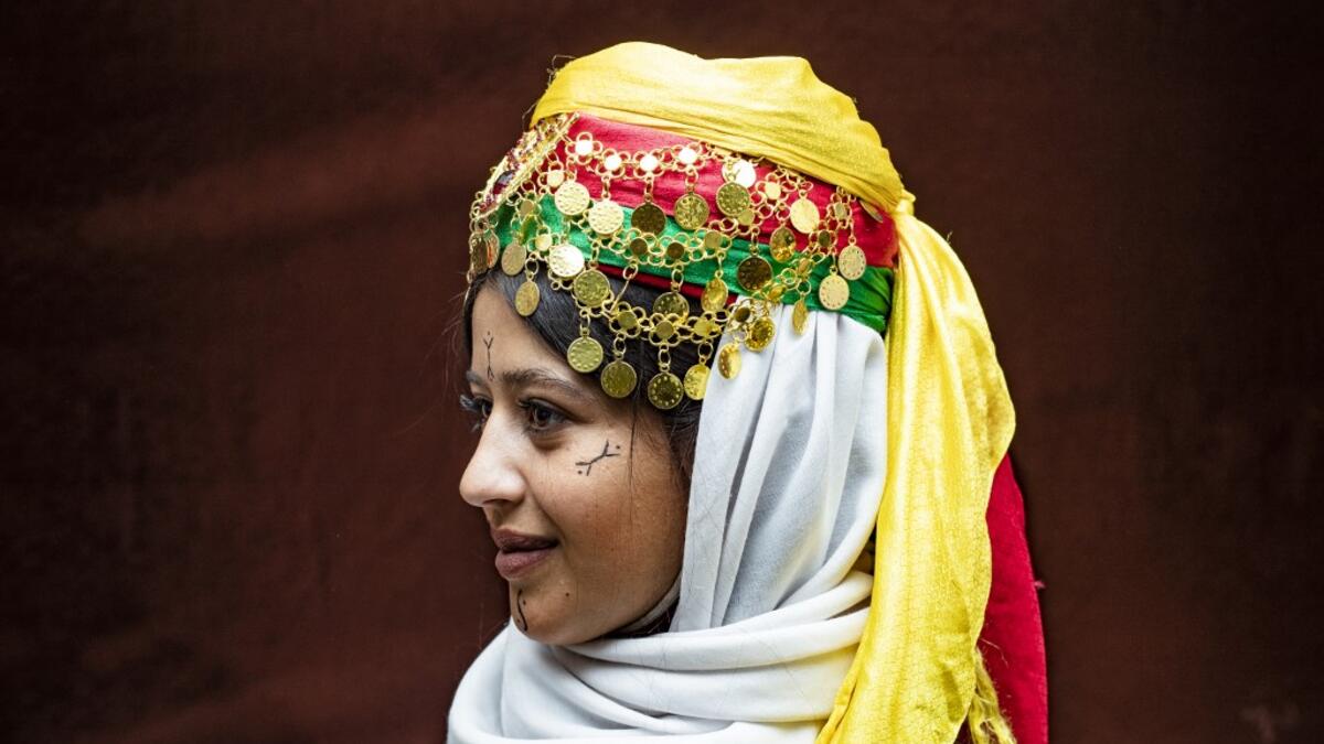 A Syrian Kurdish woman in traditional attire