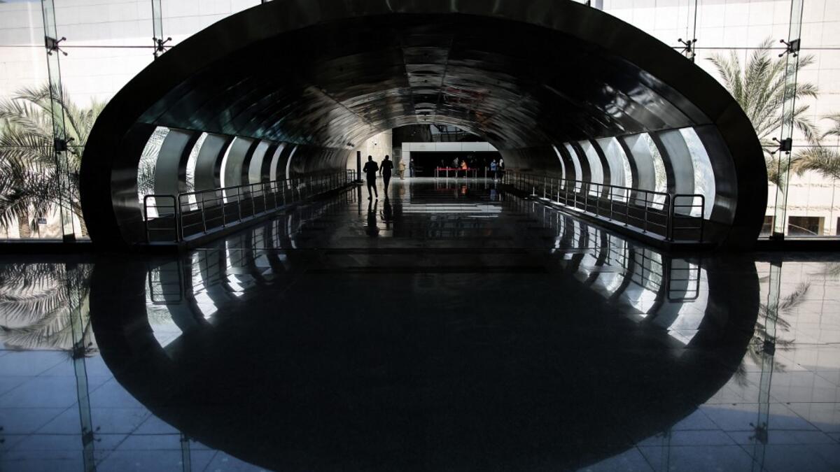 Visitors walk down a hallway at Egypt's new National Museum of Egyptian Civilisation (NMEC), in the Fustat district of Old Cairo