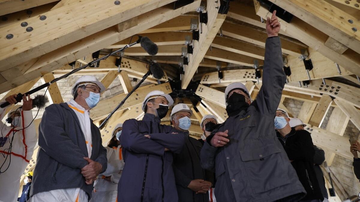French President Emmanuel Macron (2nd L) listens to the architecte in charge of the restoration Philippe Villeneuve (2nd R) next to Jean-Louis Georgelin (C), a former general leading the restoration efforts, Paris' Archbishop Michel Aupetit (L), and Paris' mayor Anne Hidalgo, during a visit of Notre-Dame de Paris Cathedral