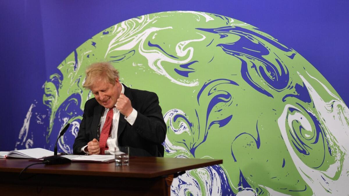 Britain's Prime Minister Boris Johnson speaks during the opening session of the virtual US Leaders’ Summit on Climate from the Downing Street Briefing Room in central London