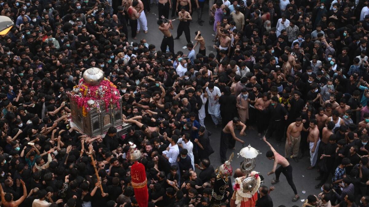 Shiite Muslim devotees take part in a procession