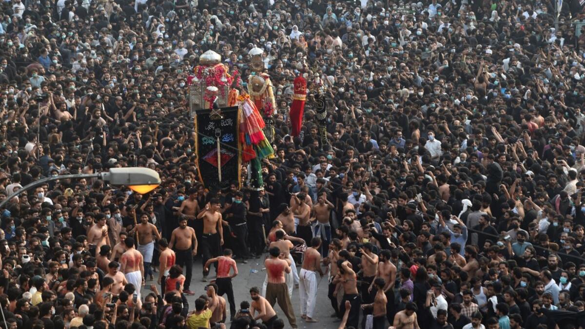 Shiite Muslim devotees take part in a procession to commemorate the death anniversary of Prophet Mohammad's companion and son-in-law Imam Ali in Lahore