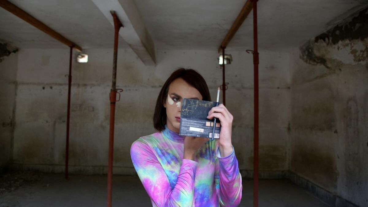 Albanian transgender Luana, puts her makeup on, in the former Communist-era maximum security prison for political prisoners in Spac, prior to a photo shoot on May 17, 2021. For the first time, four transgender women decided to participate in an Exhibition "Being Transgender in Albania" to fight the stigma and increase awareness on trans issues.After years of isolation